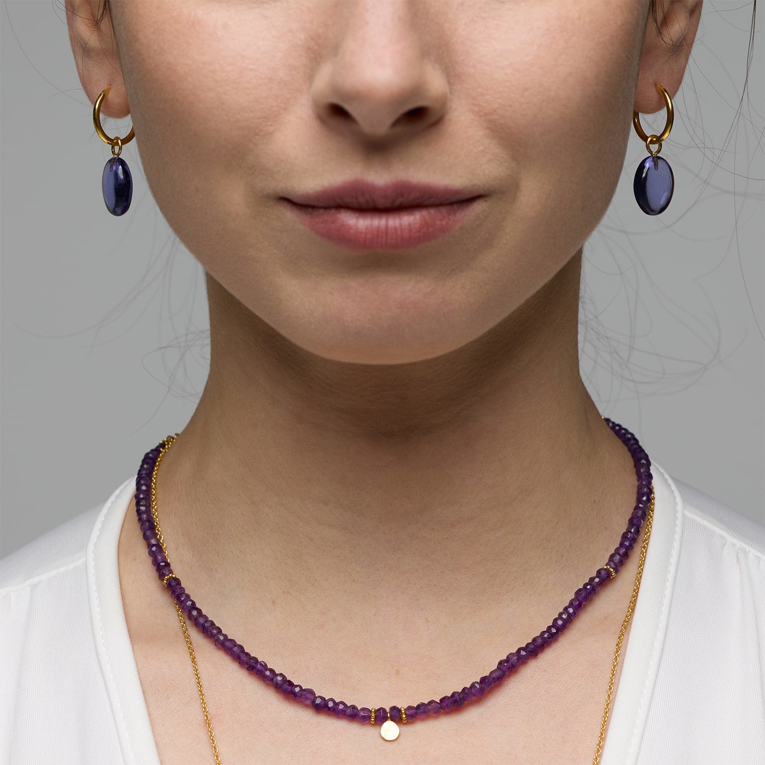 A stunning gemstone beaded necklace is exactly what your wardrobe is missing. The Ines Amethyst Necklace is handmade with vintage amethyst gemstones and a 18k gold vermeil round charm.