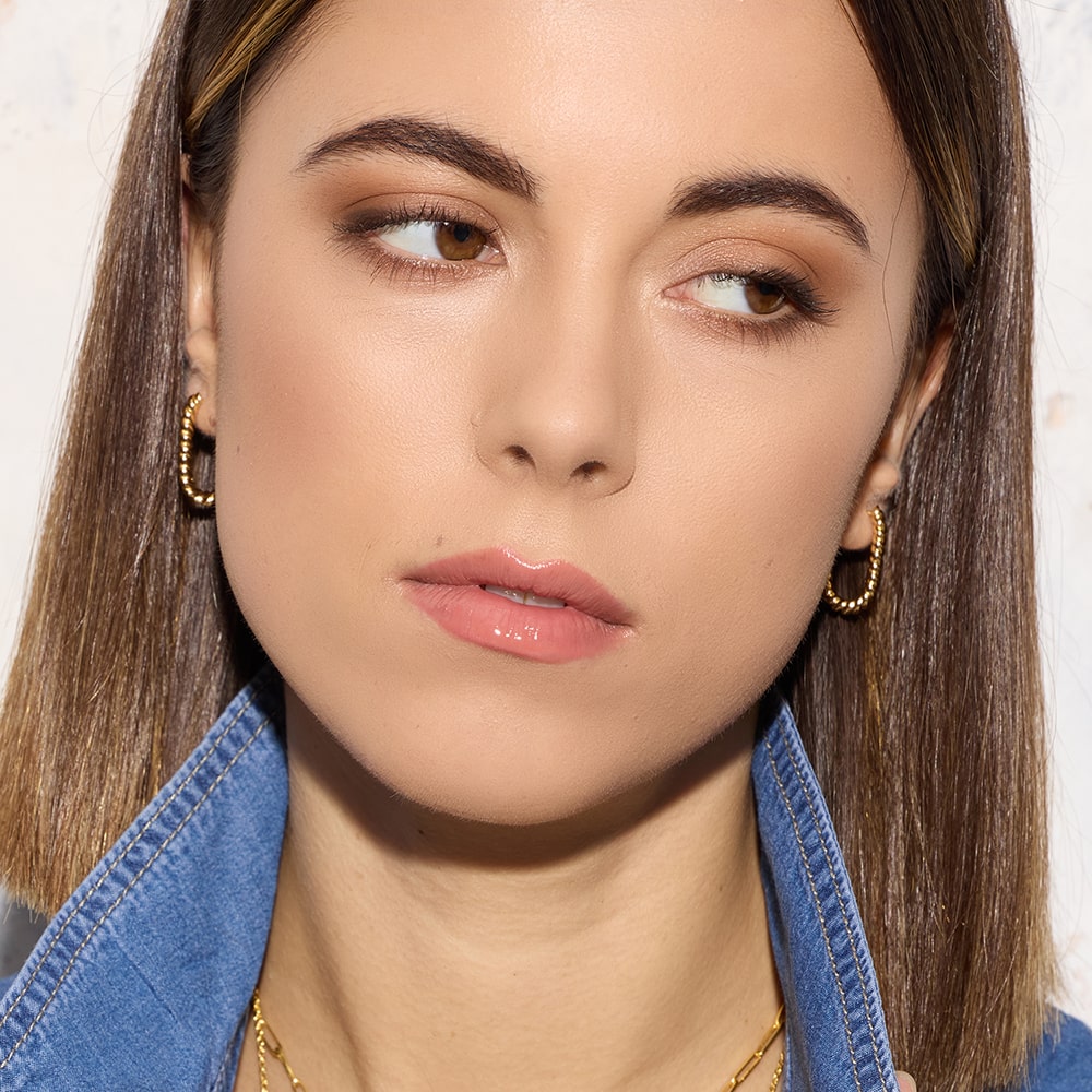 Add a sleek additon to your everyday styling with our Lilly Twisted Rectangular Gold Hoop Earrings. Handmade with sustainable materials, these earrings are truly versatile.&nbsp;