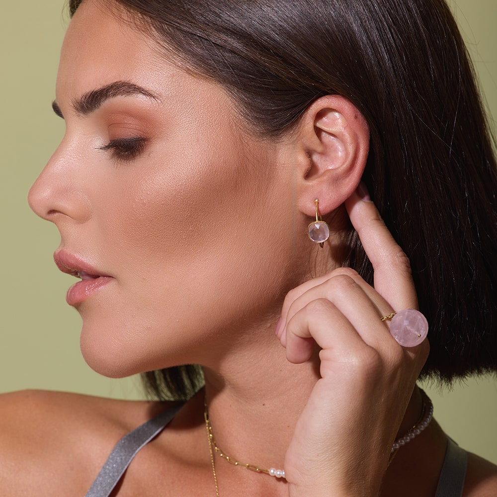 The Sophia Pink Quartz Gold Earrings are elegant sustainable gold hoops adorned with a vintage pink quartz gesmtone which creates a distinctive focal point.